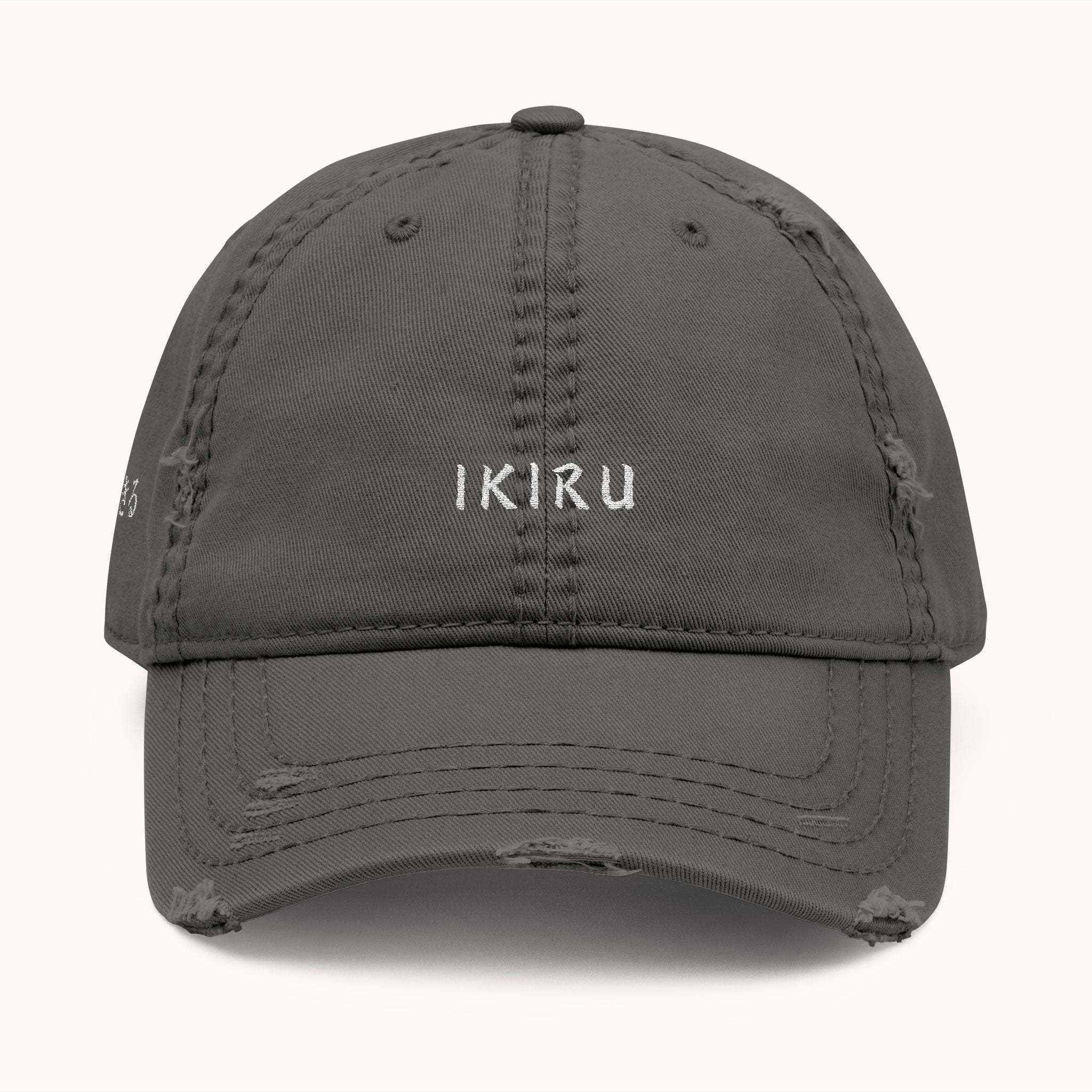 Gray cap with 'IKIRU' branding on a white background