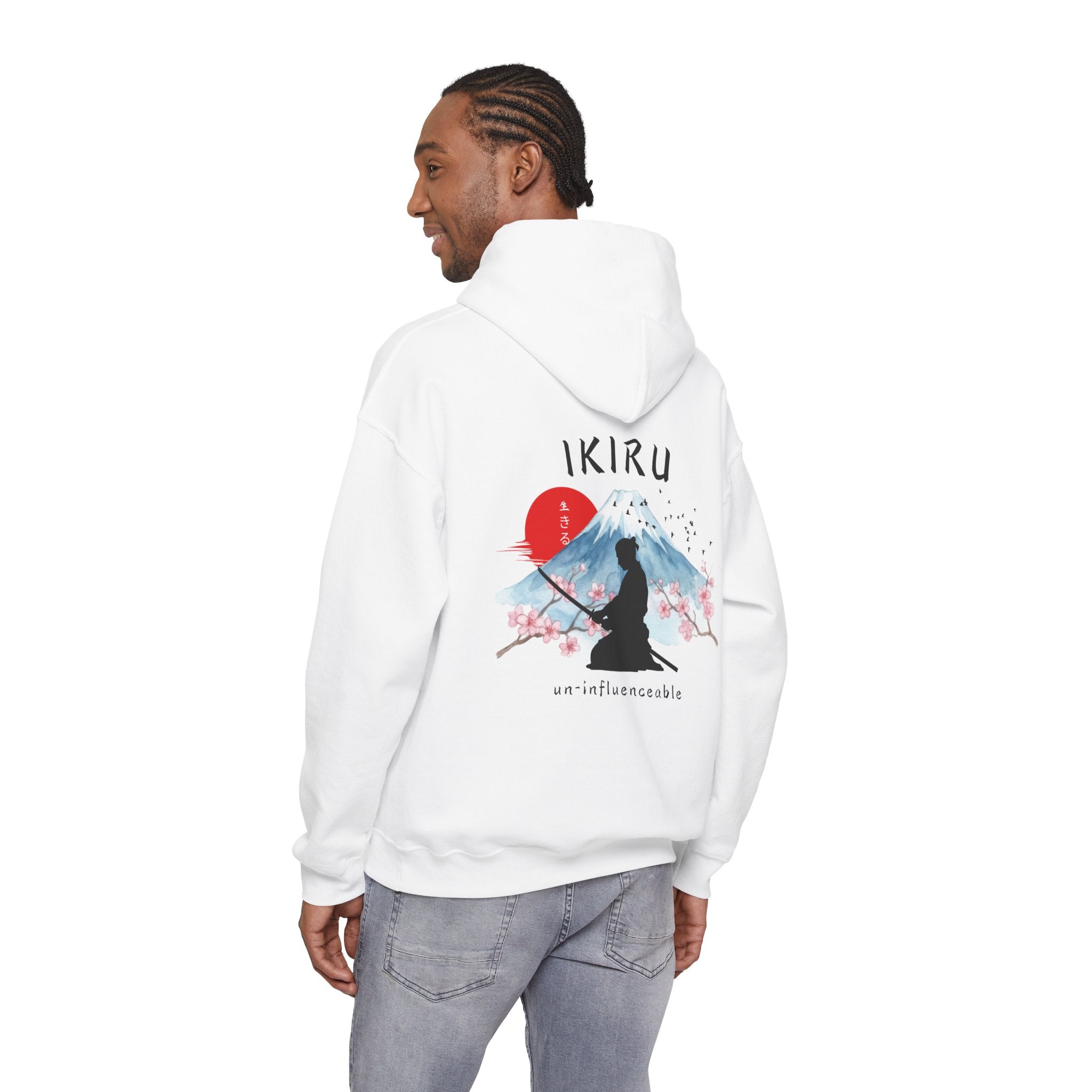 White hoodie with 'IKIRU' and mountain, samurai, and blossom tree design on the back saying 'un-influenceable' against a white background