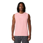 Person wearing a pink sleeveless shirt with a logo on a white background