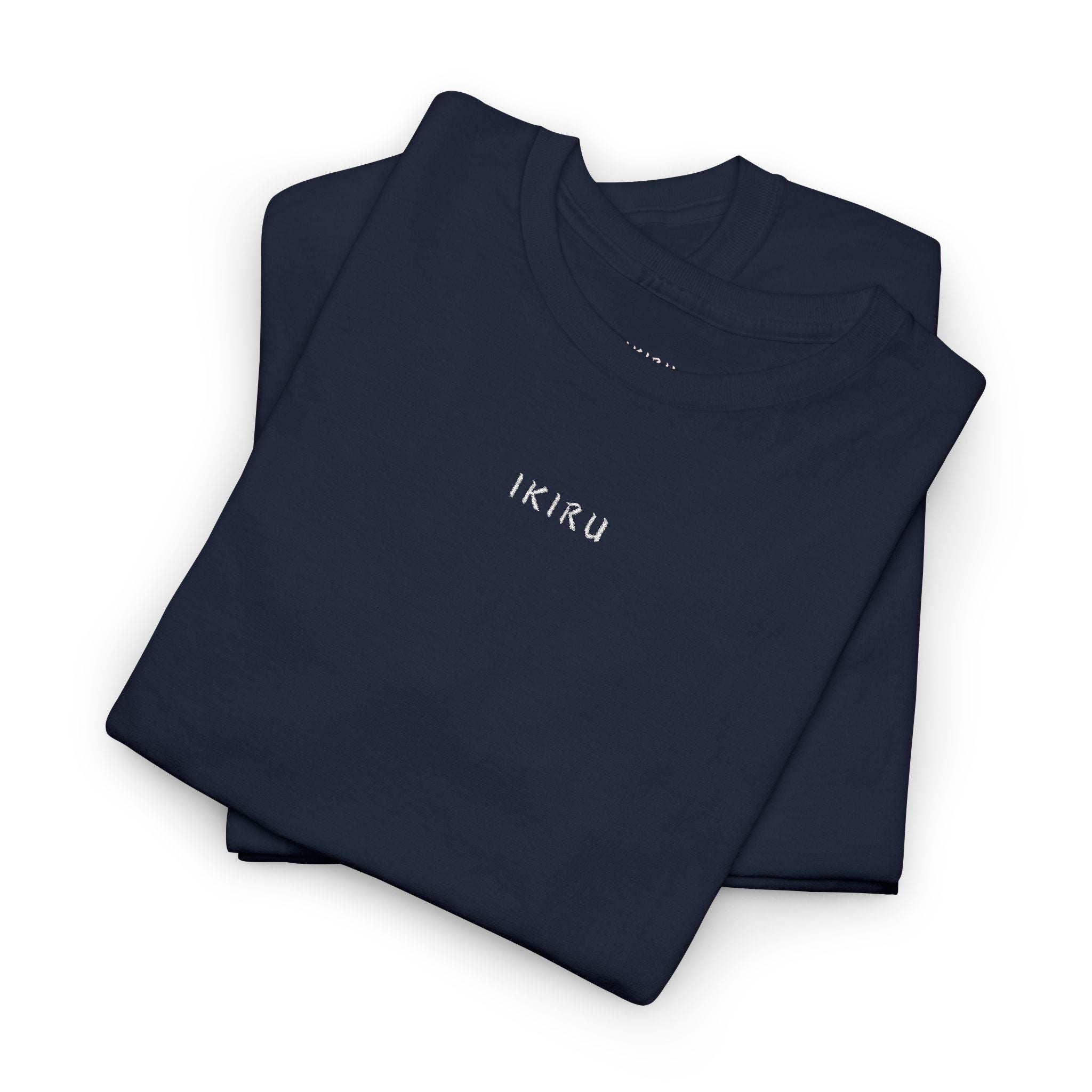 Folded navy blue shirt with 'IKIRU' branding on a white background