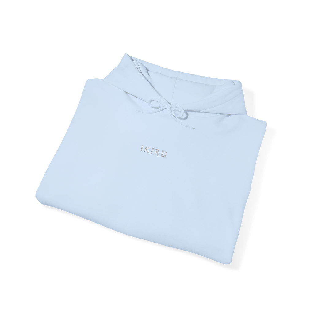 Light blue folded hoodie with an IKIRU logo on a white background