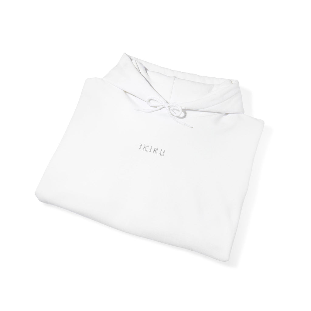 Folded white hoodie with IKIRU logo on a white background