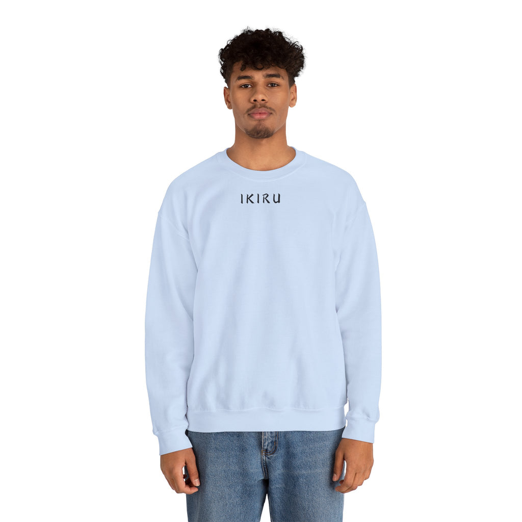 Man wearing a light blue ikiru sweatshirt on a white background