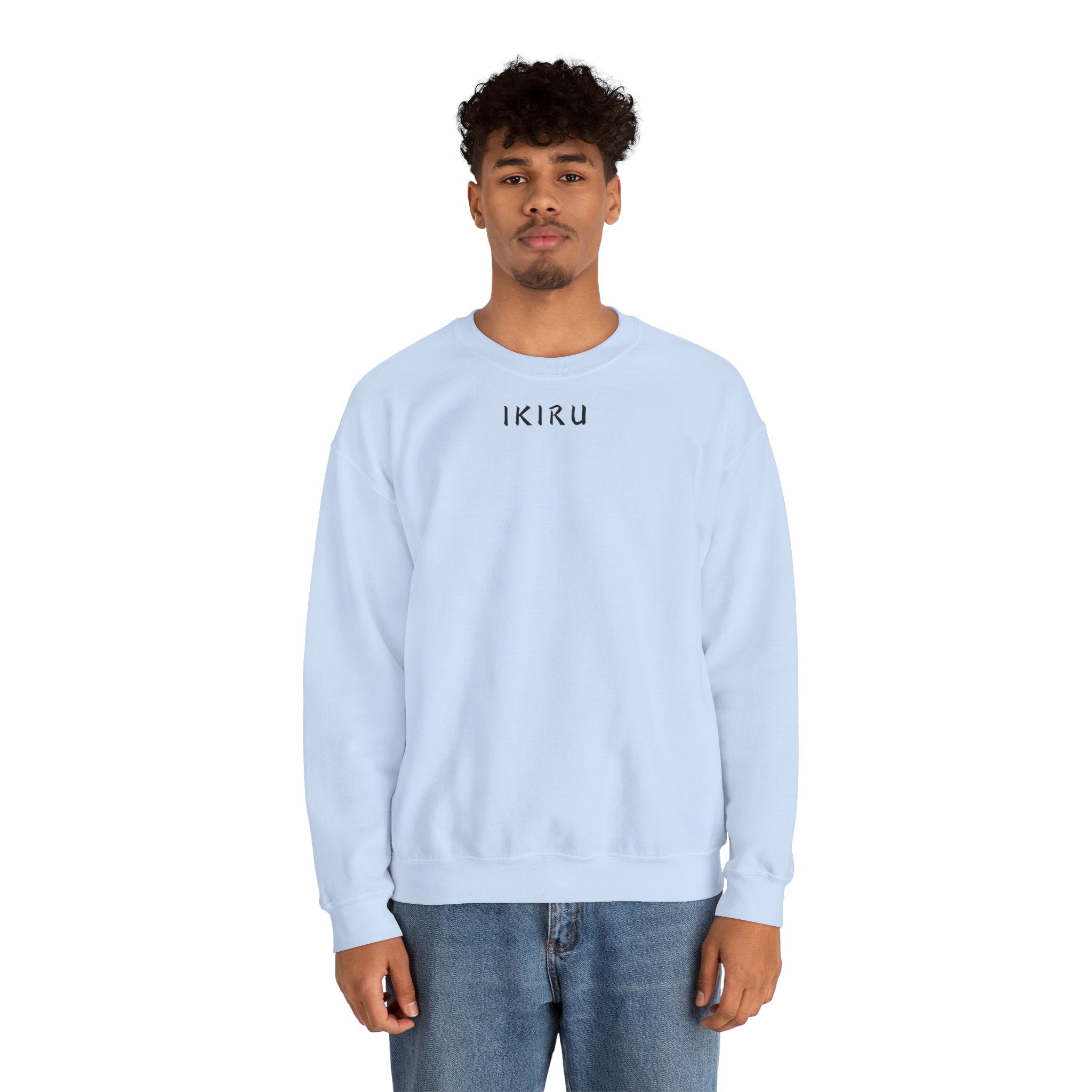Man wearing a light blue ikiru sweatshirt on a white background