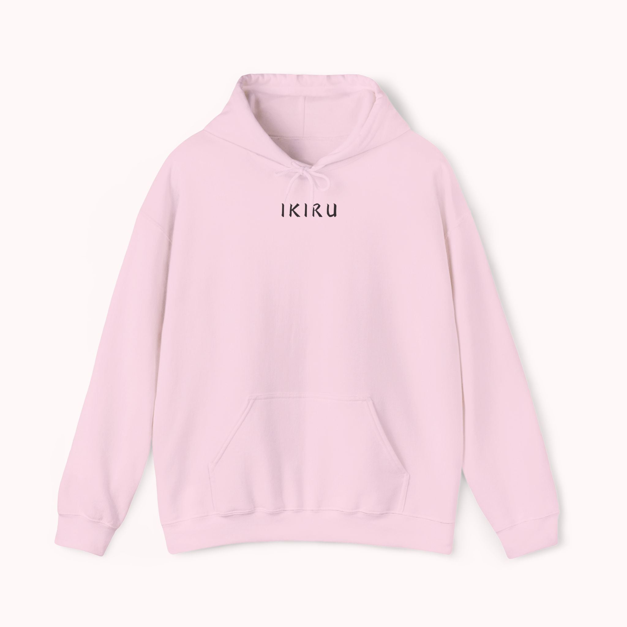 Light pink hoodie with 'IKIRU' and mountain, samurai, and blossom tree design on the back saying 'un-influenceable' against a white background