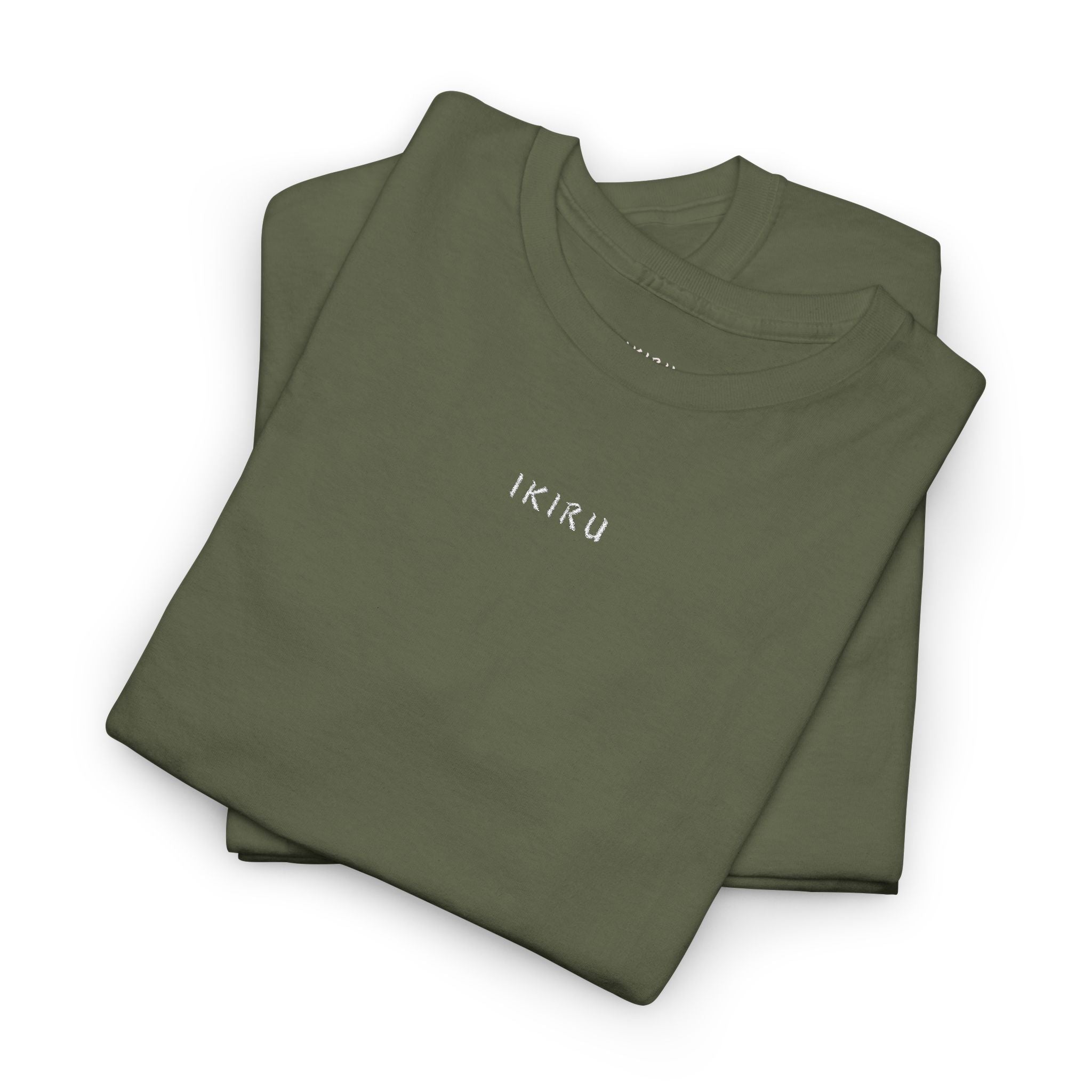 Two folded green shirts with 'IKIRU' branding on a white background