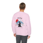 Man wearing pink sweater with a mountain, samurai, and blossom tree design on the back saying 'un-influenceable' against a white background