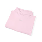 Folded pink hoodie with an IKIRU logo on a white background