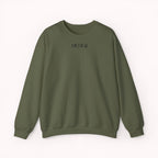 Green sweater with a small ikiru logo on a white background