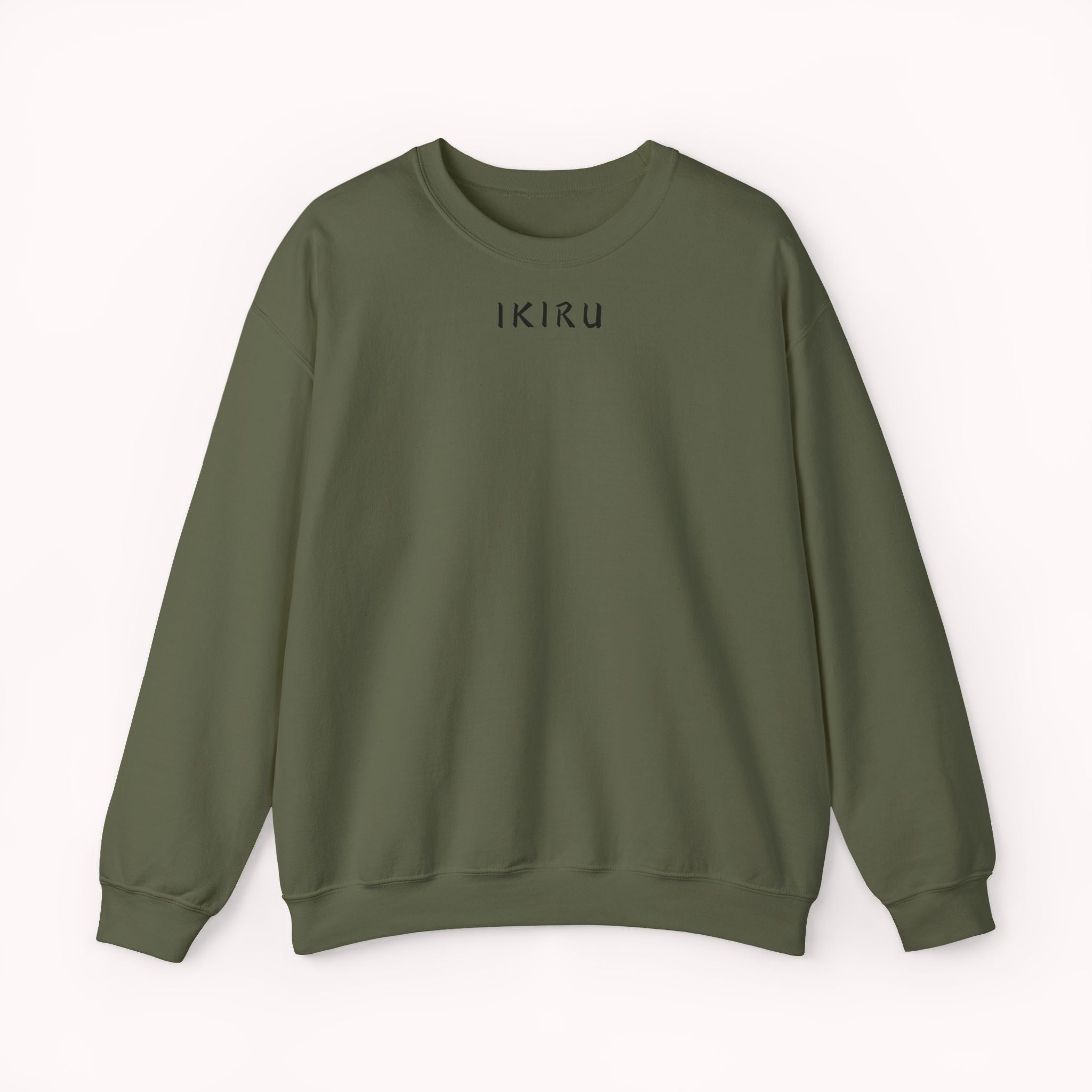 Green sweater with a small ikiru logo on a white background