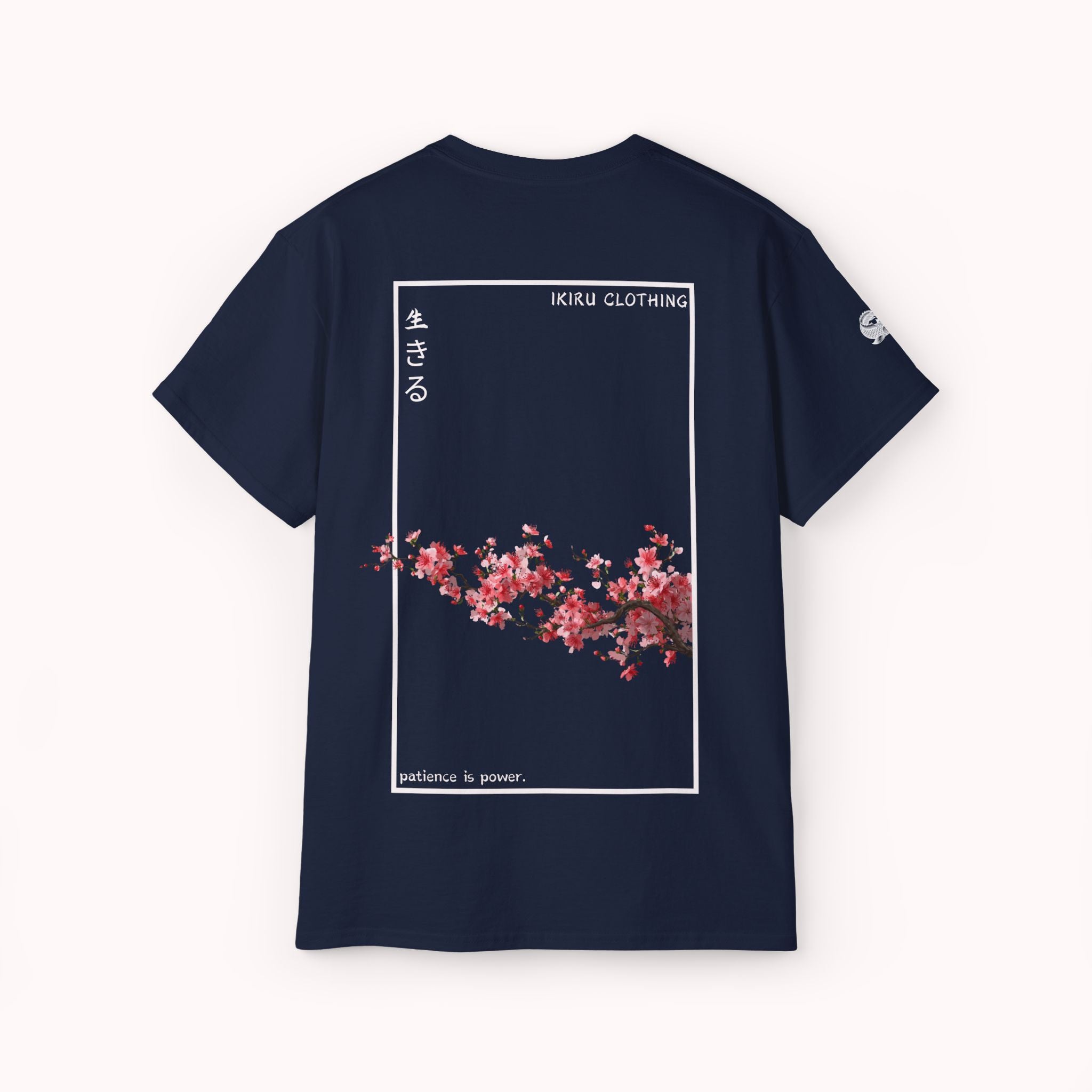 Navy t-shirt with cherry blossom design and 'IKIRU CLOTHING' branding on a white background