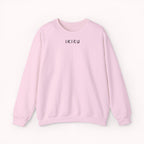 Pink sweatshirt with 'IKIRU' text on a white background