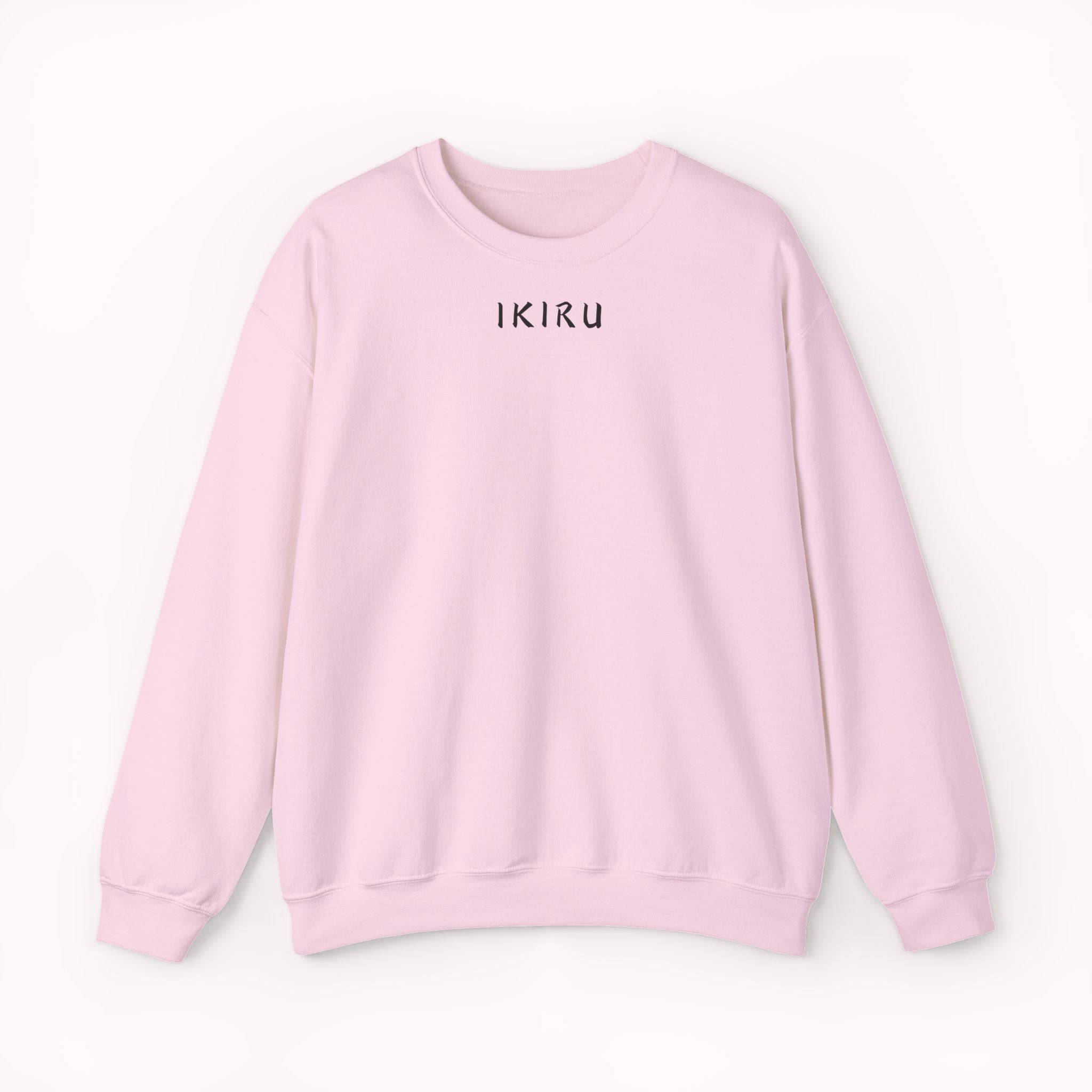 Pink sweatshirt with 'IKIRU' text on a white background