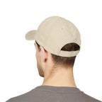 Beige cap worn by a person on a white background