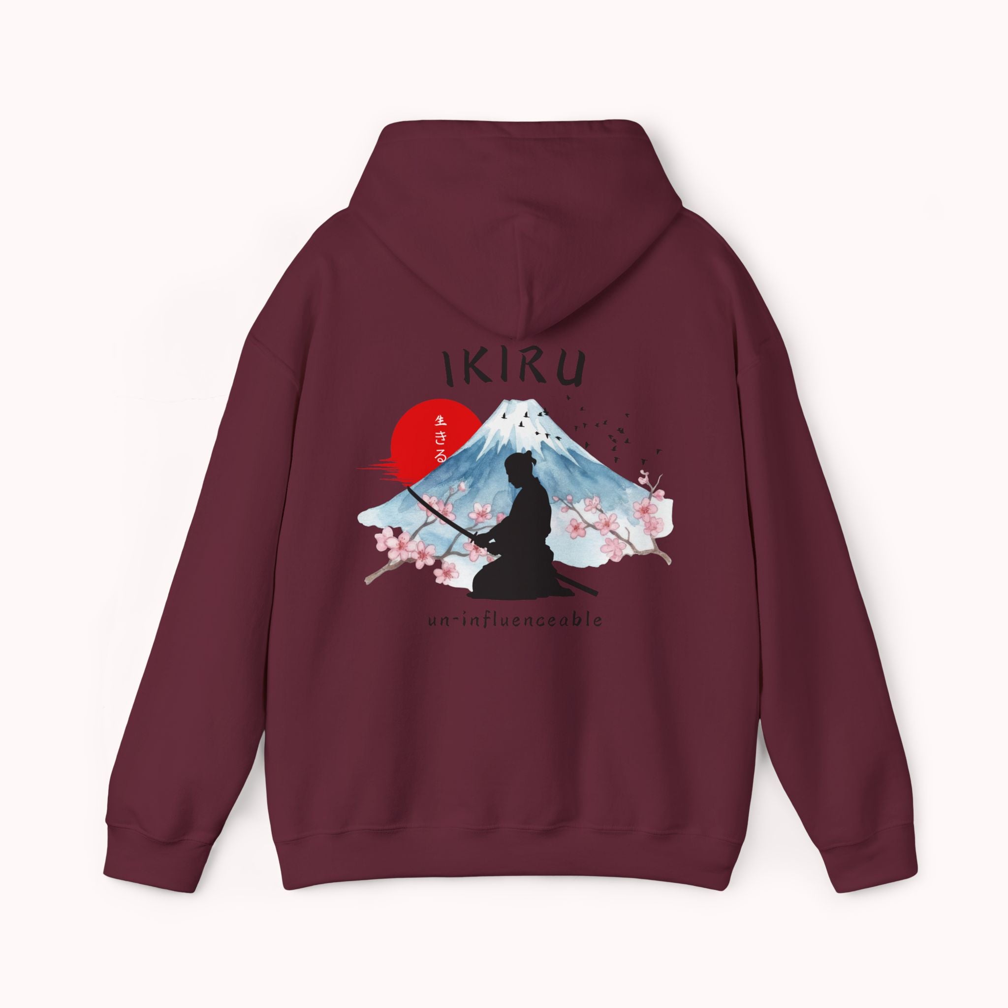 Maroon red hoodie with 'IKIRU' and mountain, samurai, and blossom tree design on the back saying 'un-influenceable' against a white background