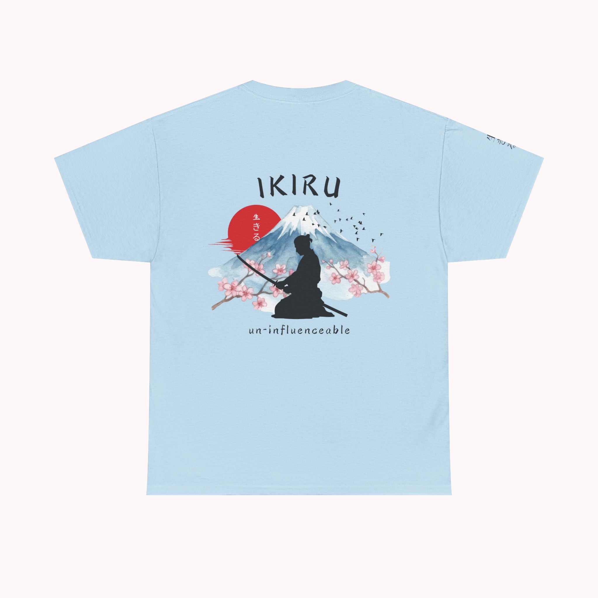 Light blue t-shirt with Japanese mountain, samurai, blossom and IKIRU on the back on a white background