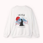 White sweater with a mountain, samurai, and blossom tree design on the back saying 'un-influenceable' against a white background