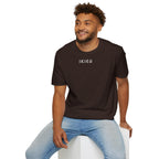 Man wearing a brown t-shirt with 'IKIRU' in white on a white background