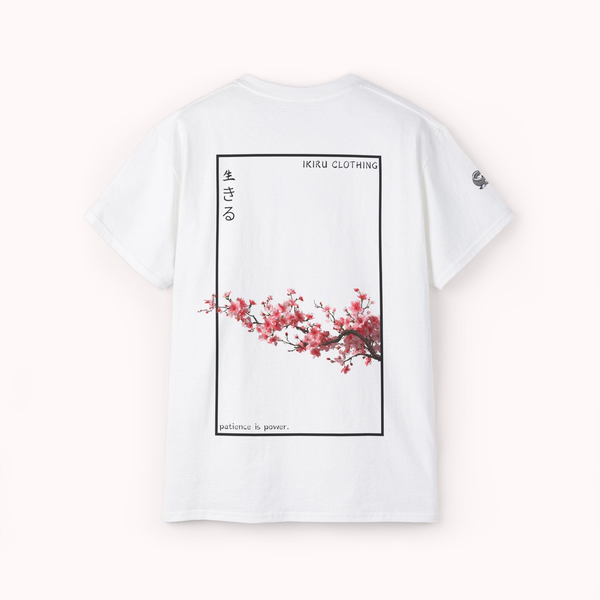 White t-shirt with cherry blossom design and IKIRU text on a white background