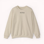 Beige sweater with a mountain, samurai, and blossom tree design on the back saying 'un-influenceable' against a white background