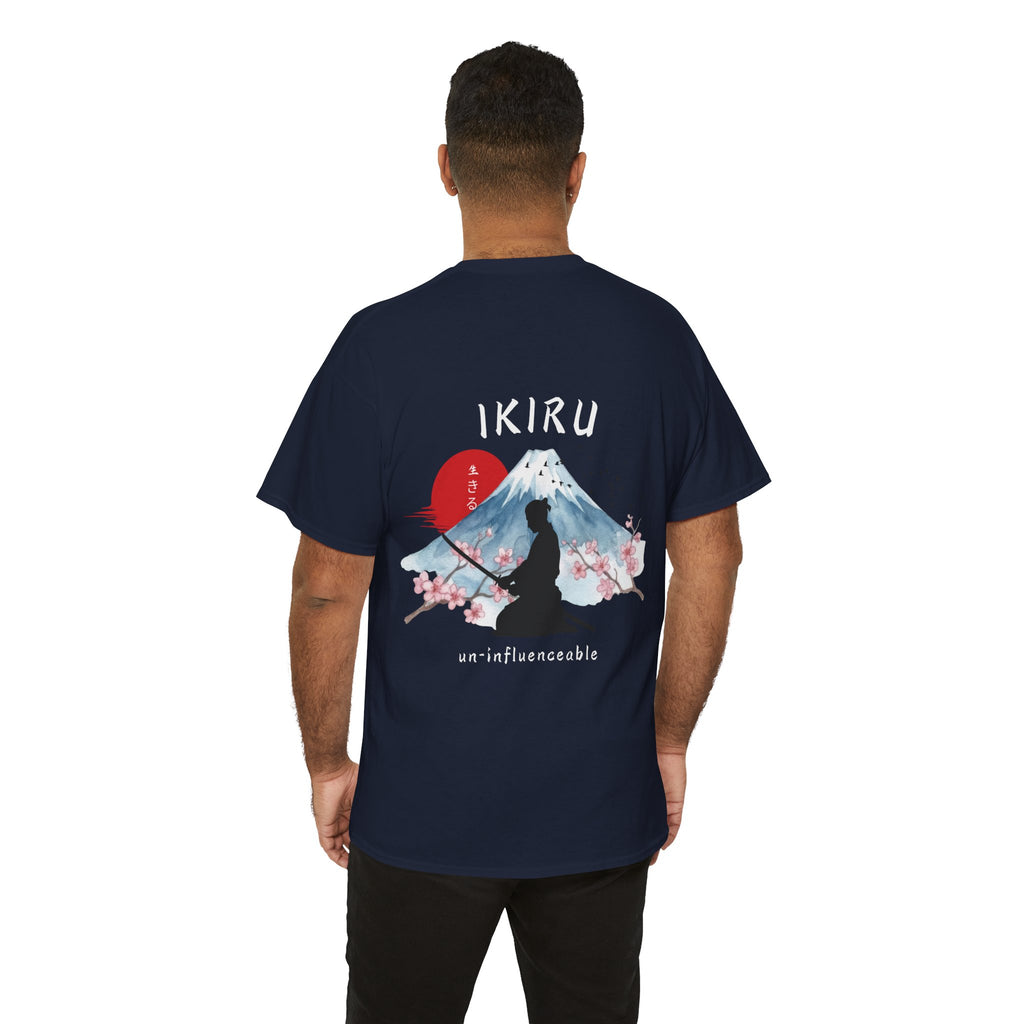 Person wearing a navy t-shirt with Japanese mountain, samurai, blossom and IKIRU on the back on a white background