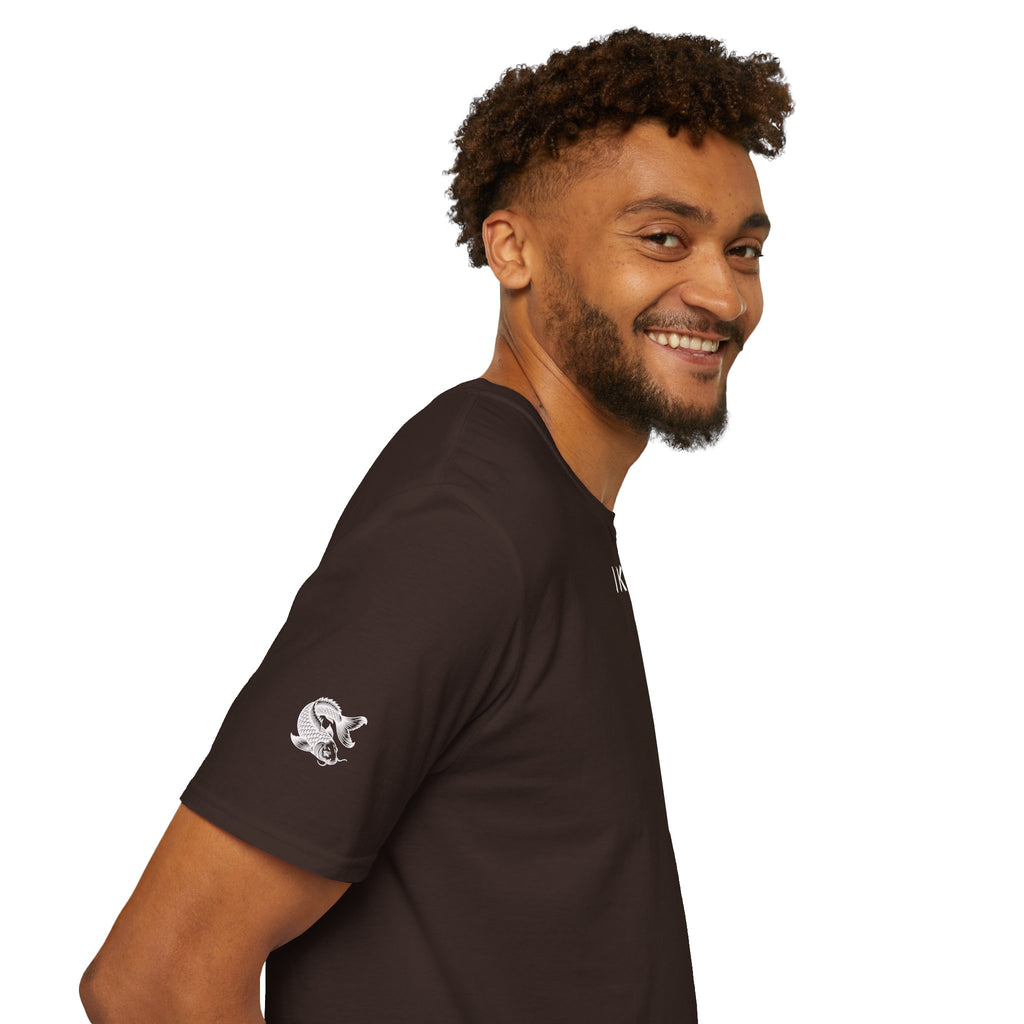 Person wearing a brown t-shirt with logo on a white background