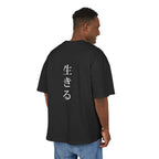 Man wearing a black t-shirt with white text on the back, standing against a white background