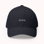 Navy cap with IKIRU branding on a white background
