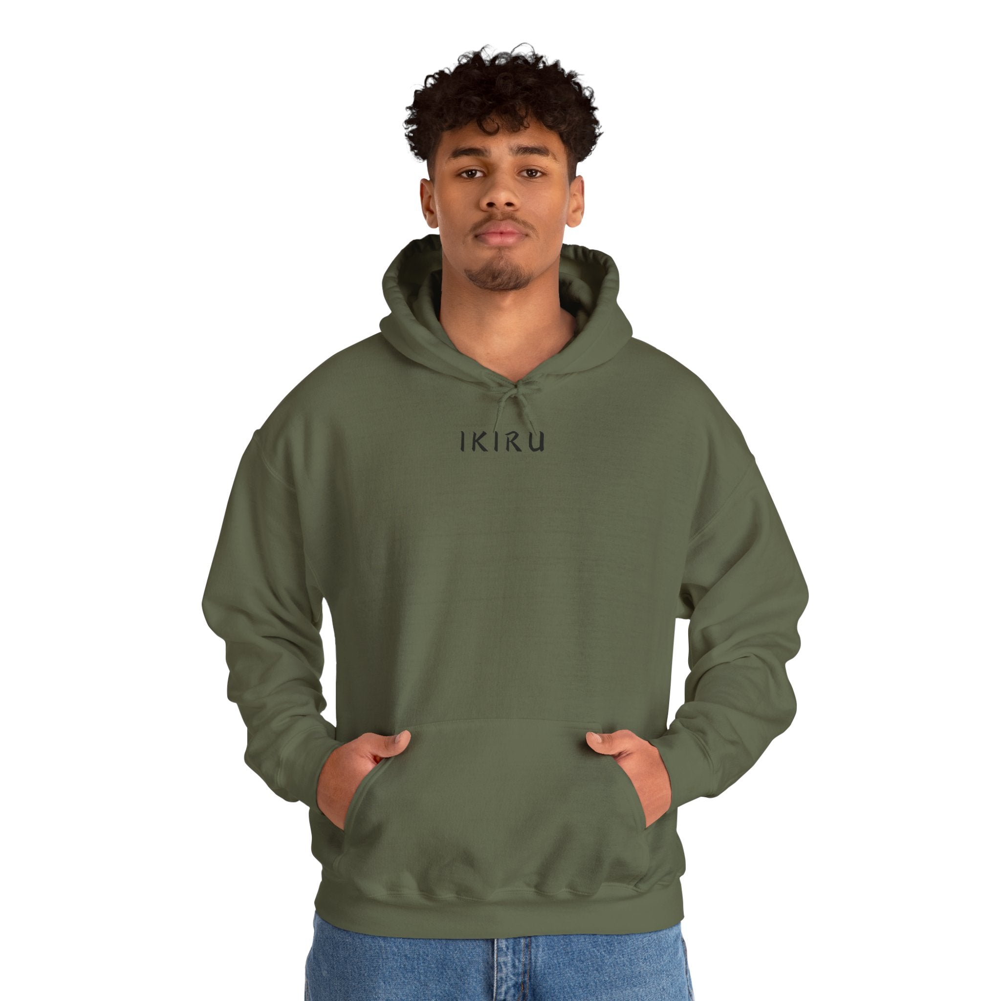 Green hoodie with 'IKIRU' and mountain, samurai, and blossom tree design on the back saying 'un-influenceable' against a white background