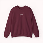 Maroon sweatshirt with 'IKIRU' printed on it against a white background