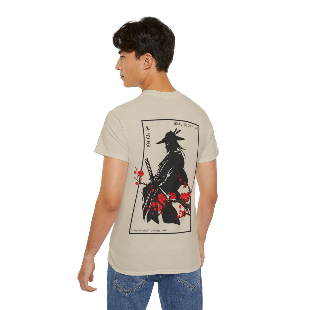 Person wearing a beige t-shirt with a japanese samurai and blossom graphic design from 'IKIRU CLOTHING' on a white background