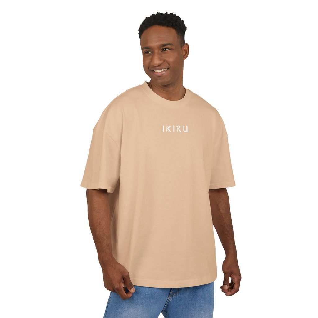 Man wearing a brown t-shirt with a logo on a white background