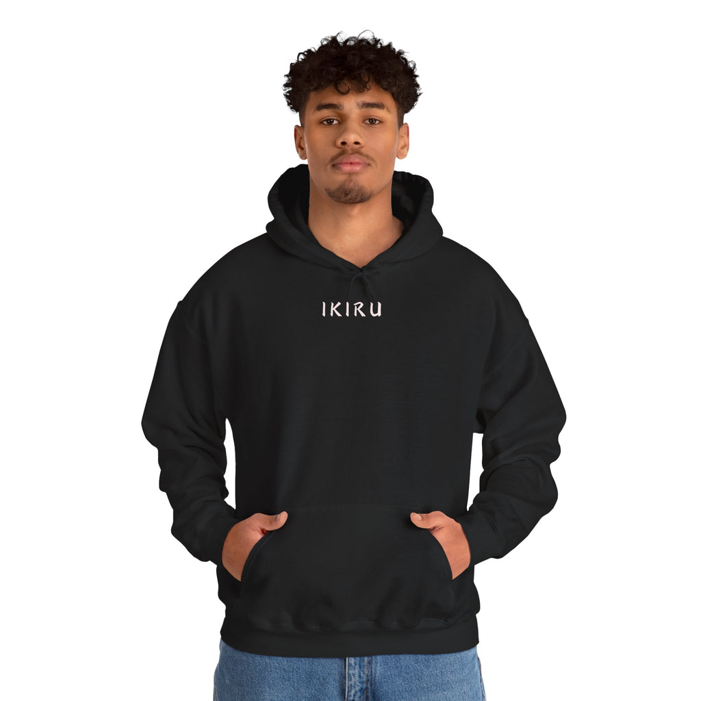 Black hoodie with 'IKIRU' and mountain, samurai, and blossom tree design on the back saying 'un-influenceable' against a white background