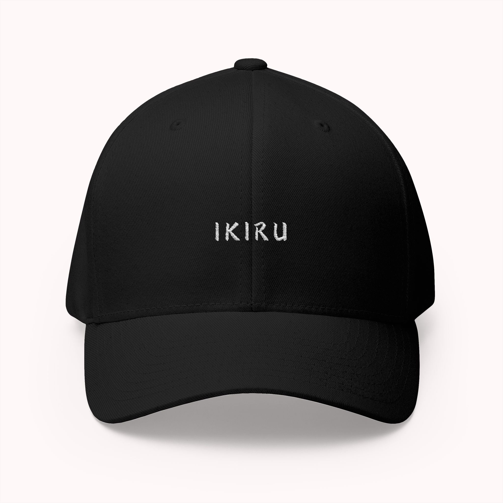 Black cap with IKIRU branding on a white background