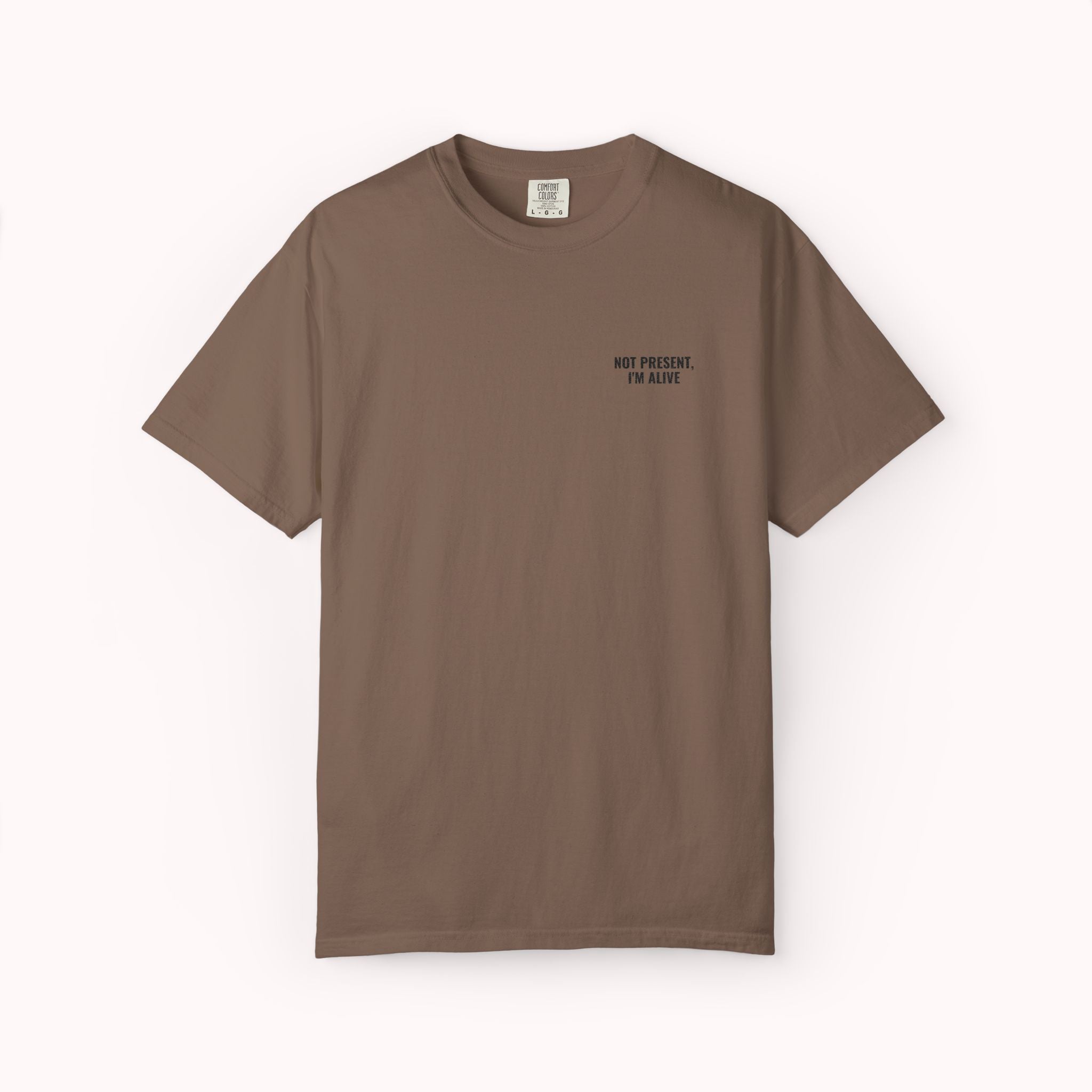 brown t-shirt with 'Not present, I'm alive' text and loading symbol on a textured white background