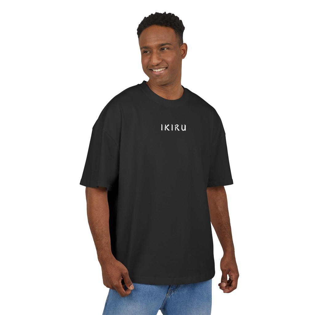 Man wearing a black t-shirt with a logo on a white background