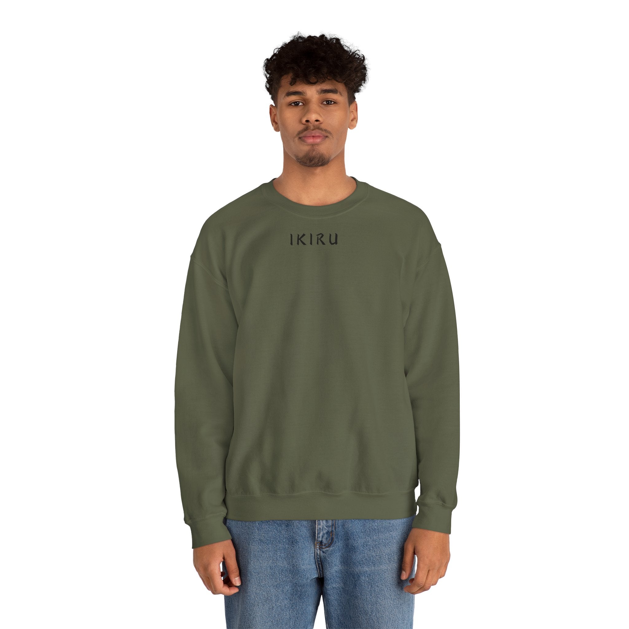 Person wearing a green sweatshirt with a small ikiru logo on a white background