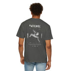 Person wearing a gray t-shirt with a logo on the back against a white background