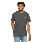 Man wearing a gray t-shirt with a logo on a white background