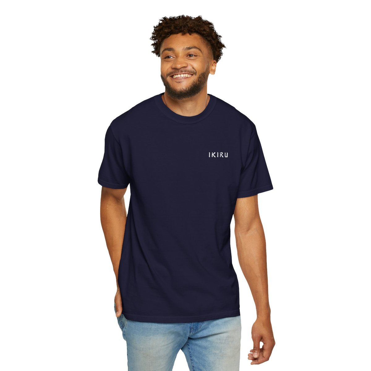 Man wearing a navy blue t-shirt with 'IKIRU' text on a white background